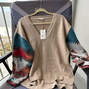 Sweater with Aztec and distressed hem detail